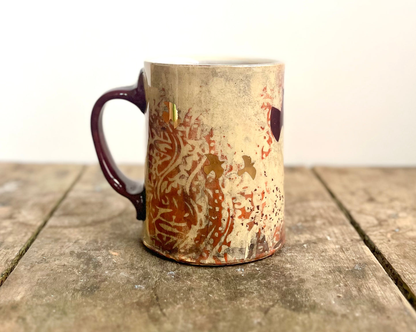 Mug with slip, gold decals and image transfer