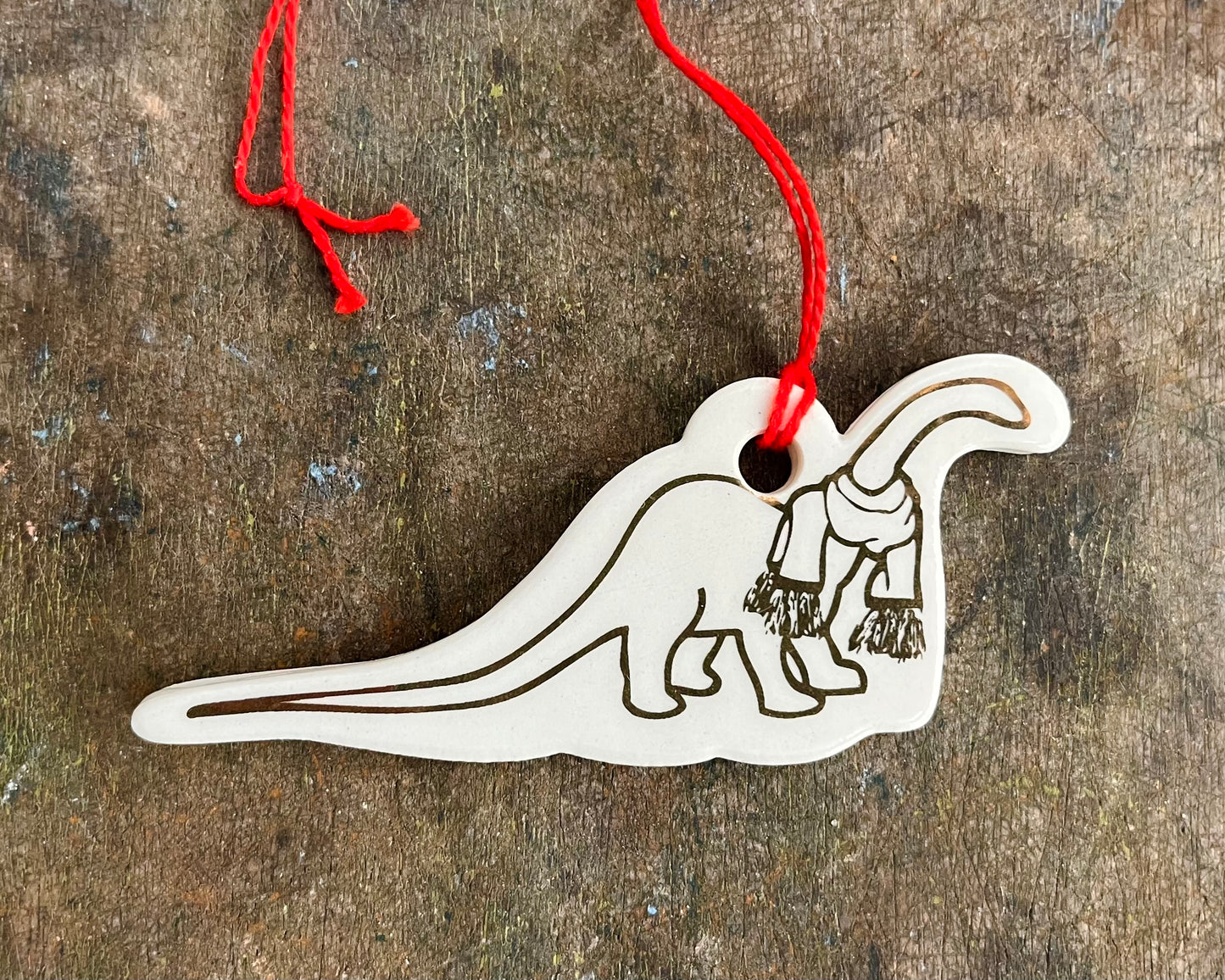 Diplodocus with scarf ornament