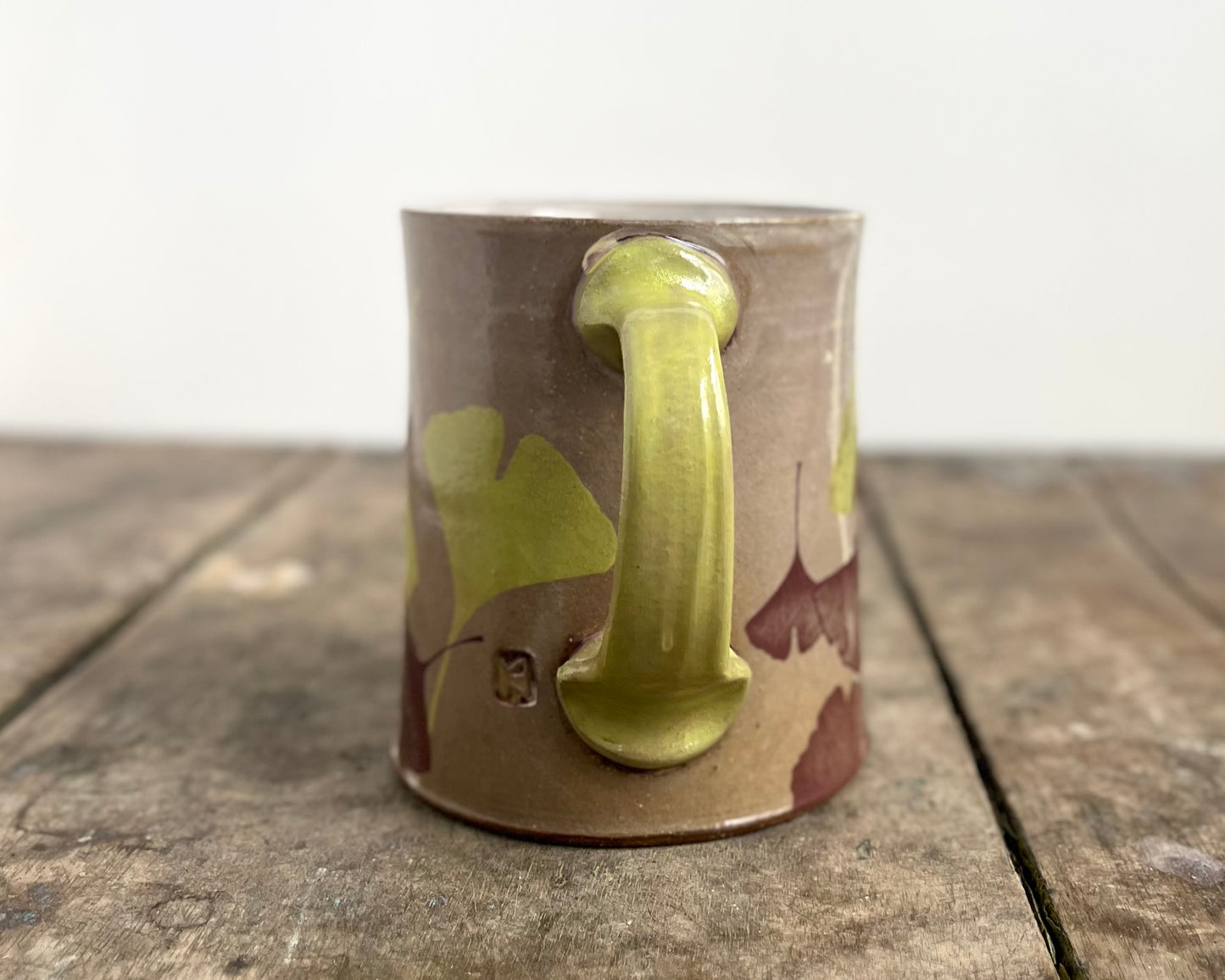 Mug with slip, gold decals and image transfer