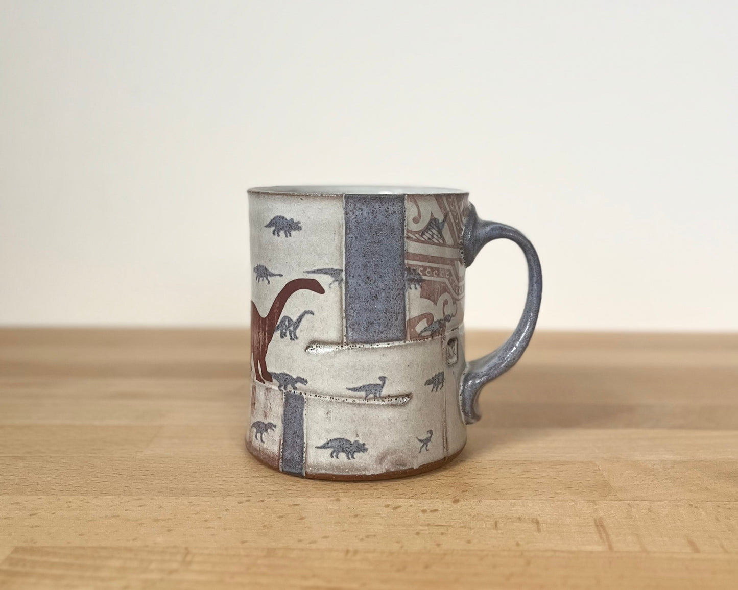 Collage mug with blue underglaze