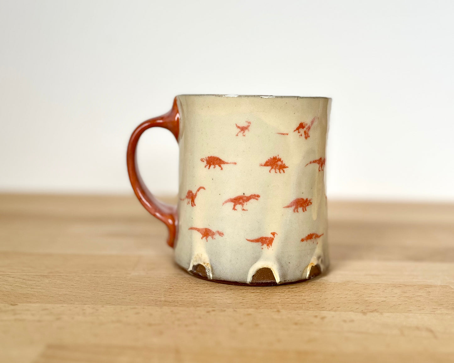 Mug with small orange dinos