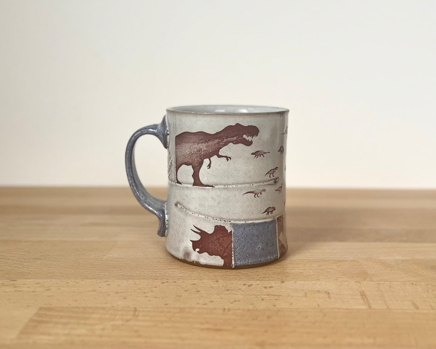 Collage mug with blue underglaze