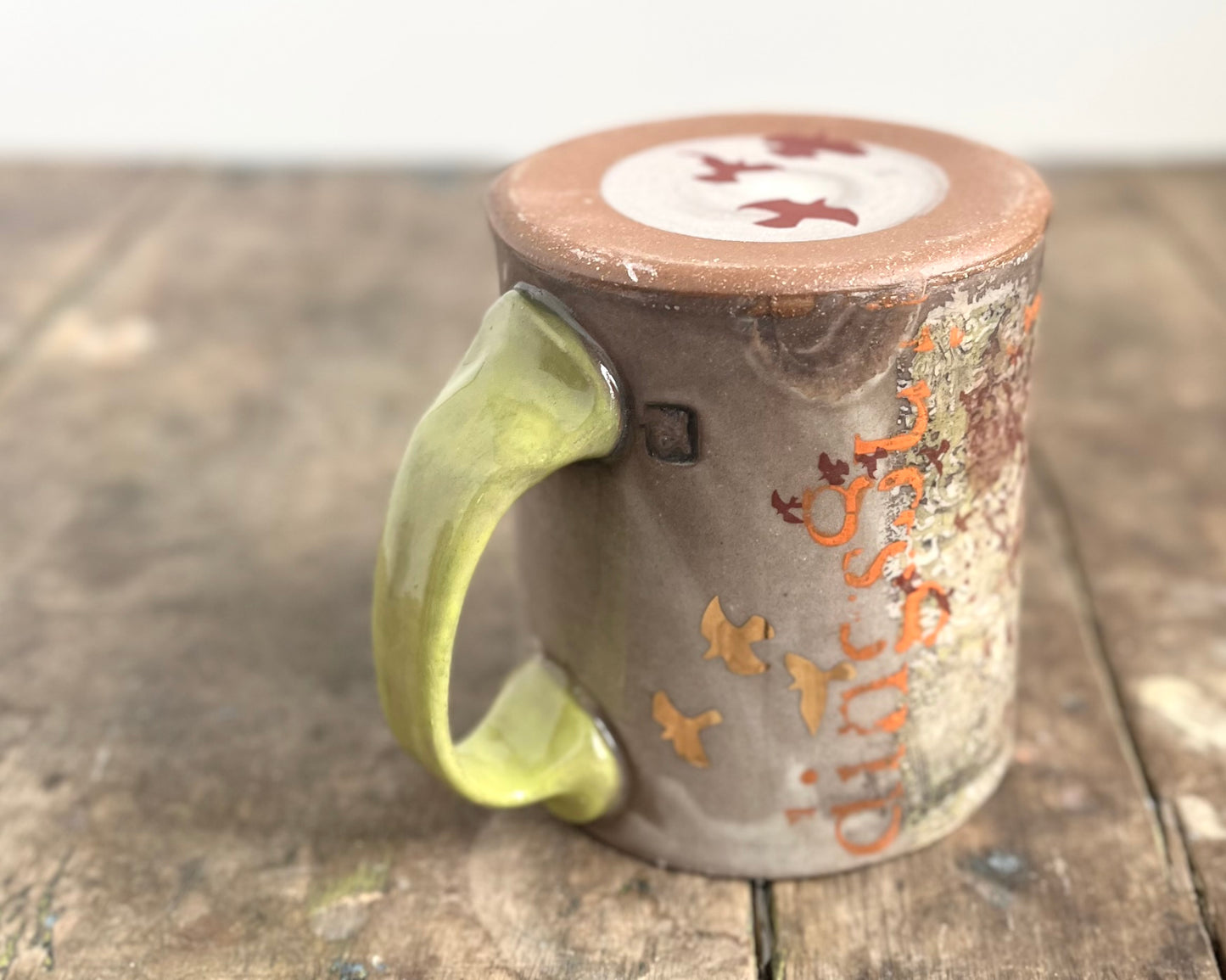 Mug with slip, gold decals and image transfer