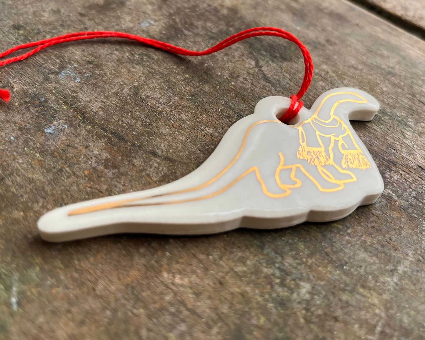 Diplodocus with scarf ornament