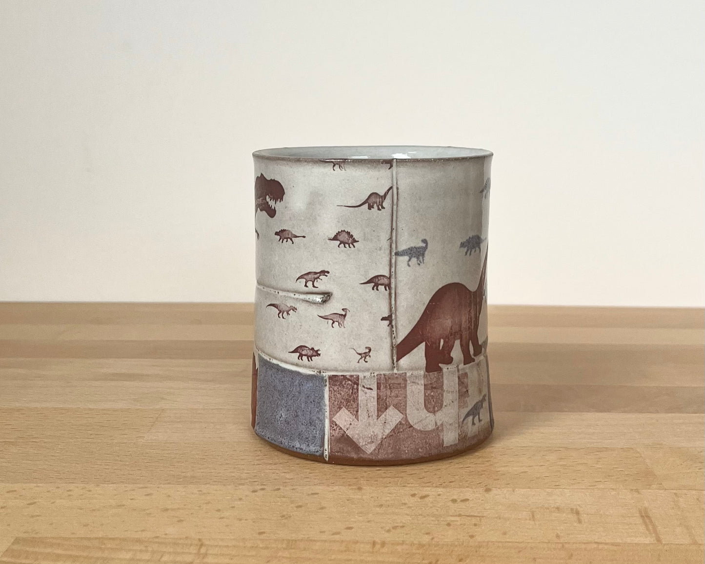 Collage mug with blue underglaze