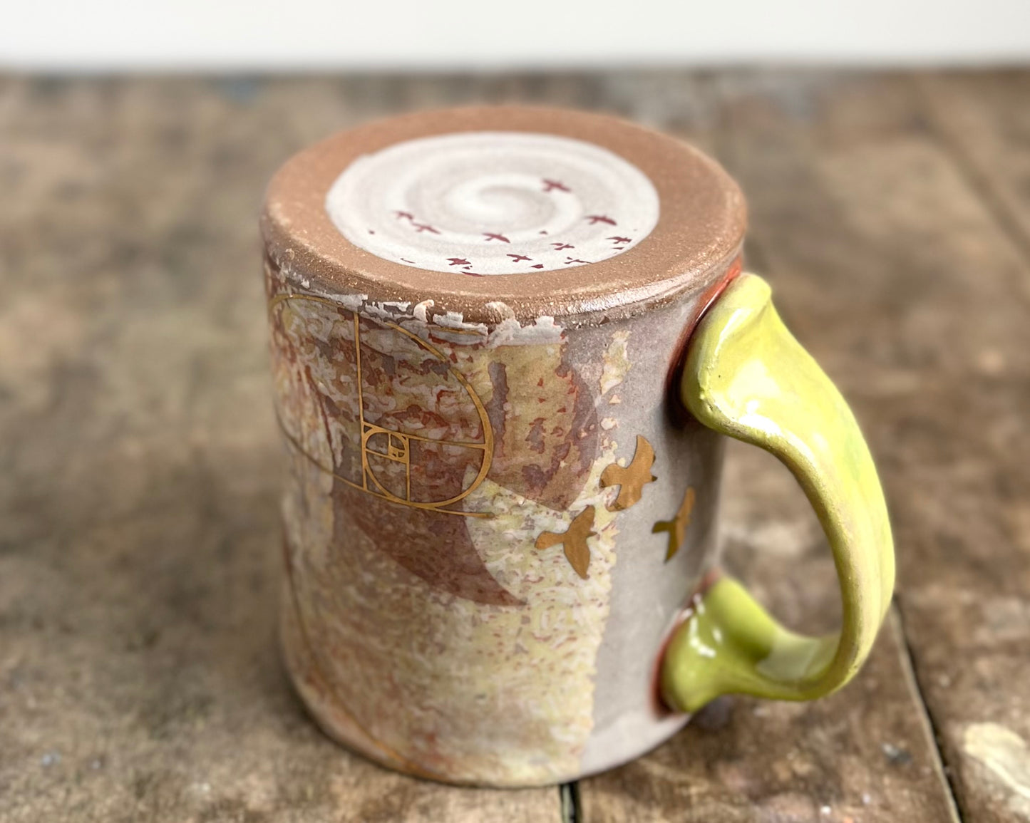 Mug with slip, gold decals and image transfer