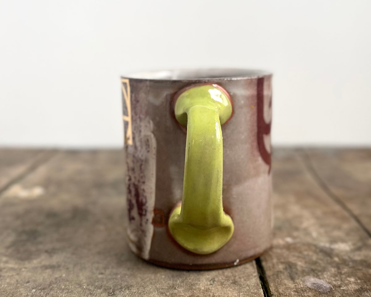 Mug with slip, gold decals and image transfer