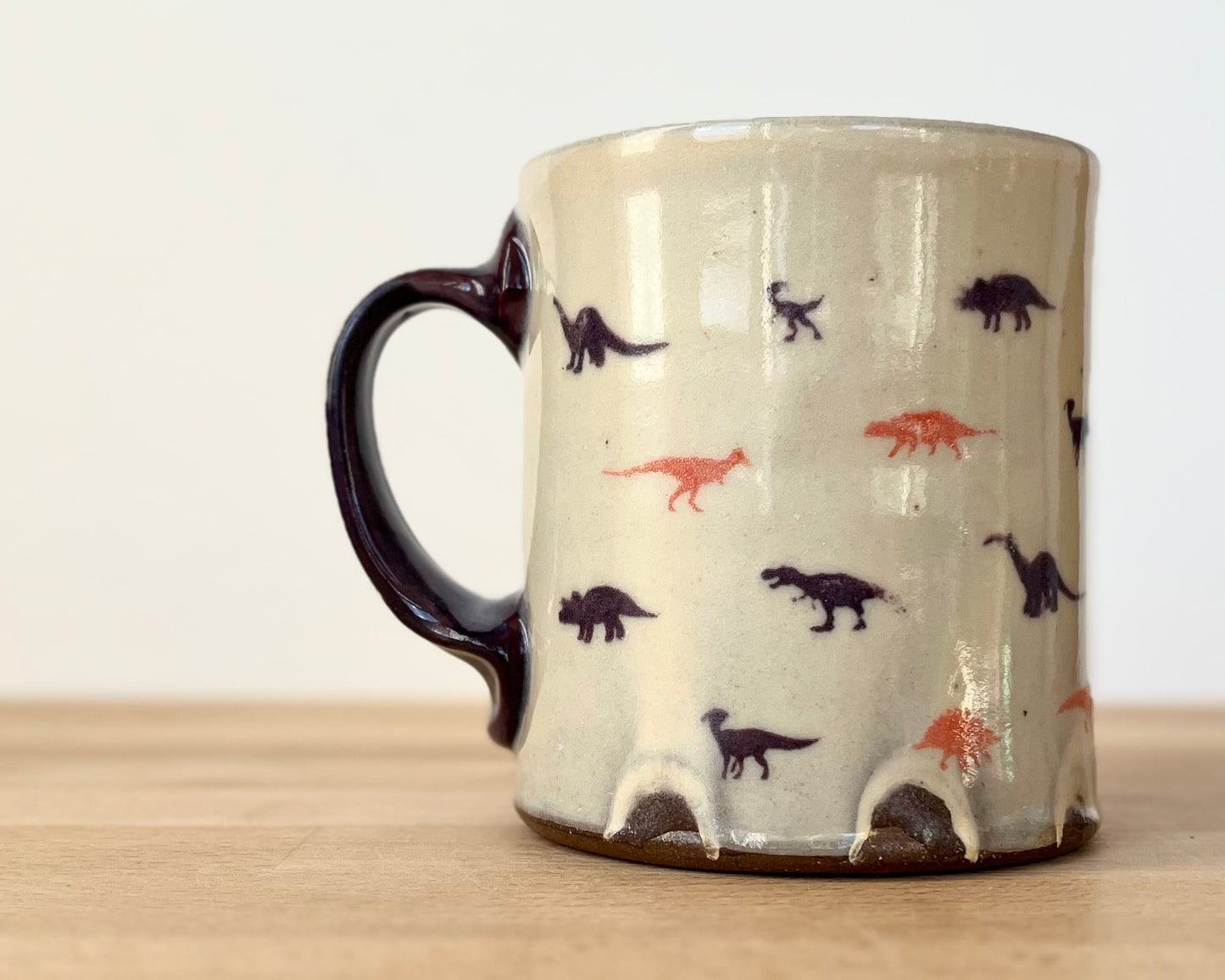 Mug with small purple and orange dinos