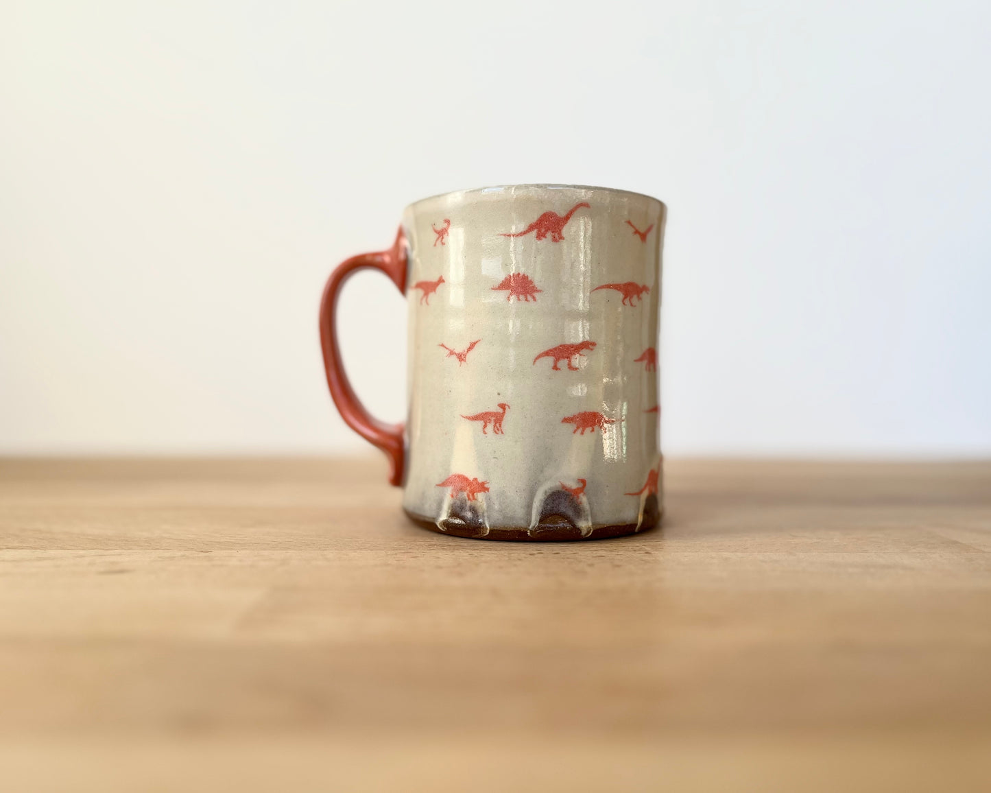 Mug with small orange dinos
