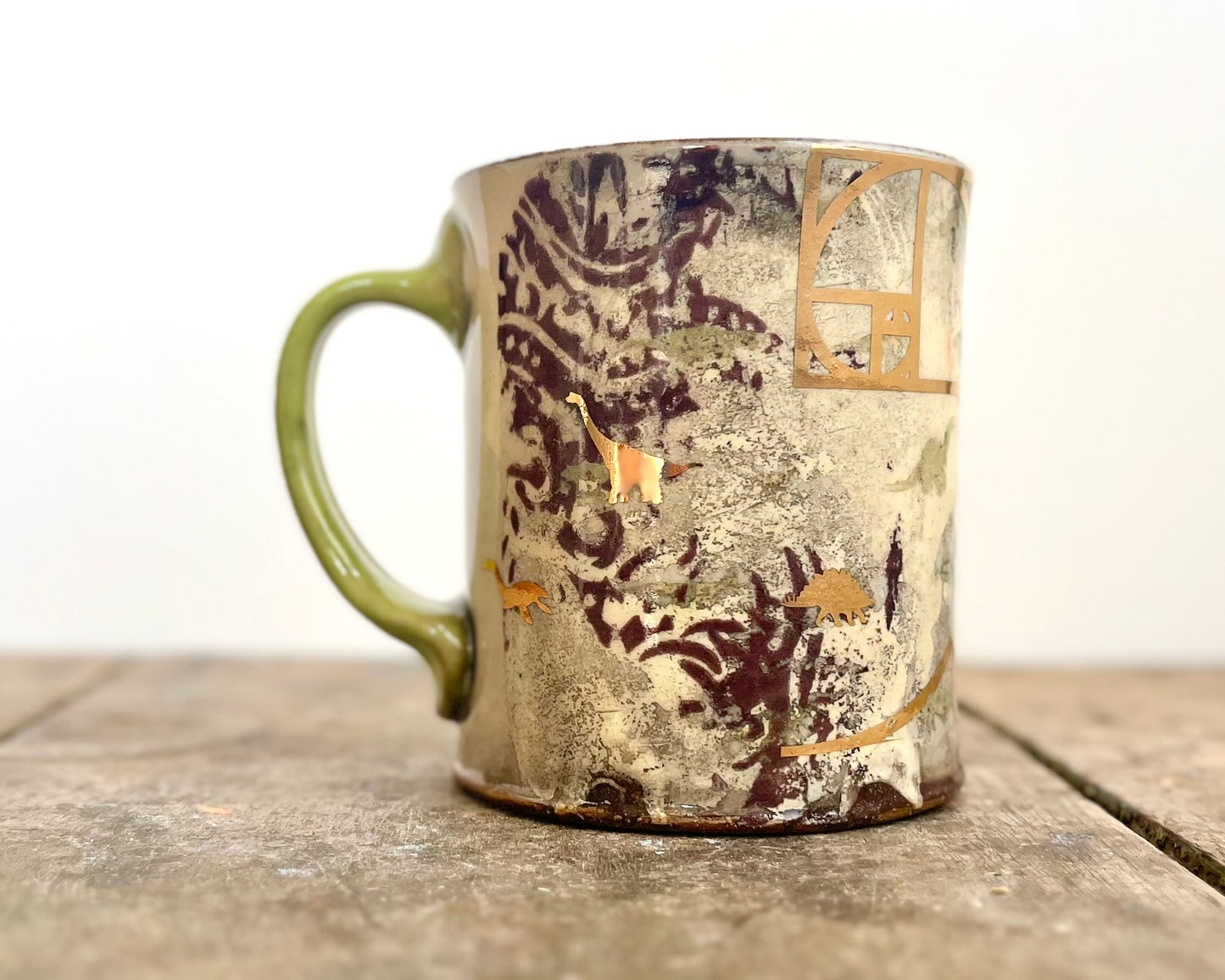 Mug with slip, gold decals and image transfer