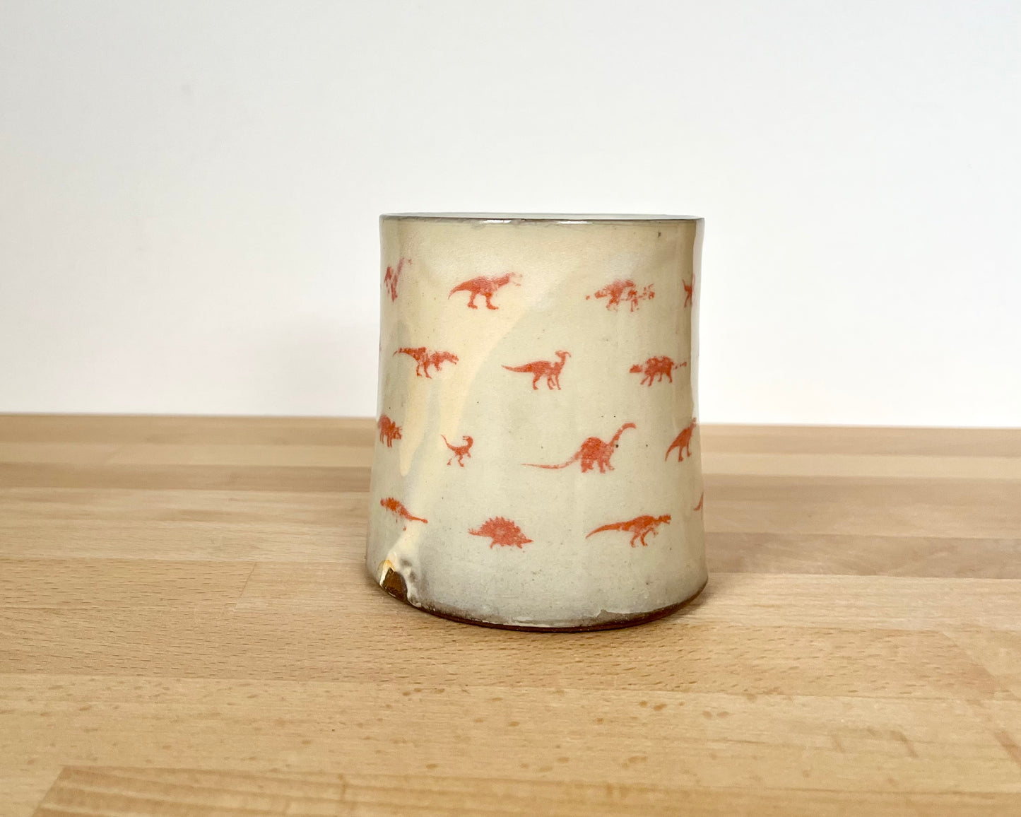 Mug with small orange dinos