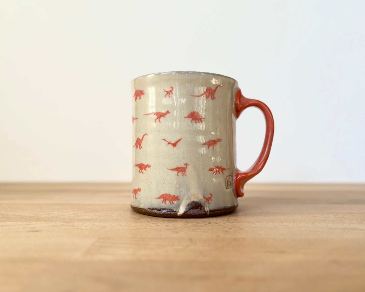 Mug with small orange dinos