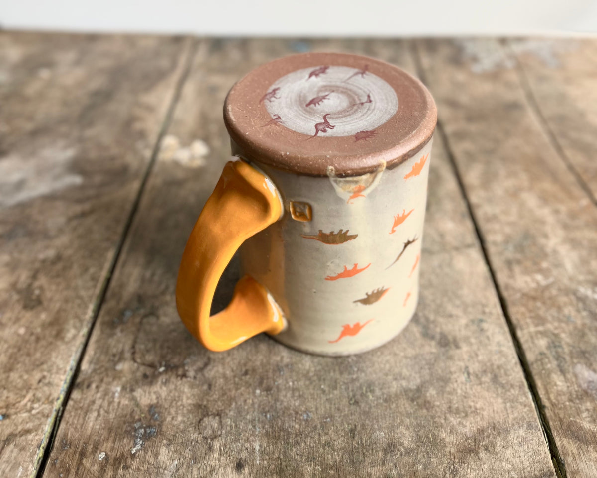 Mug with orange handle, gold decals and image transfer