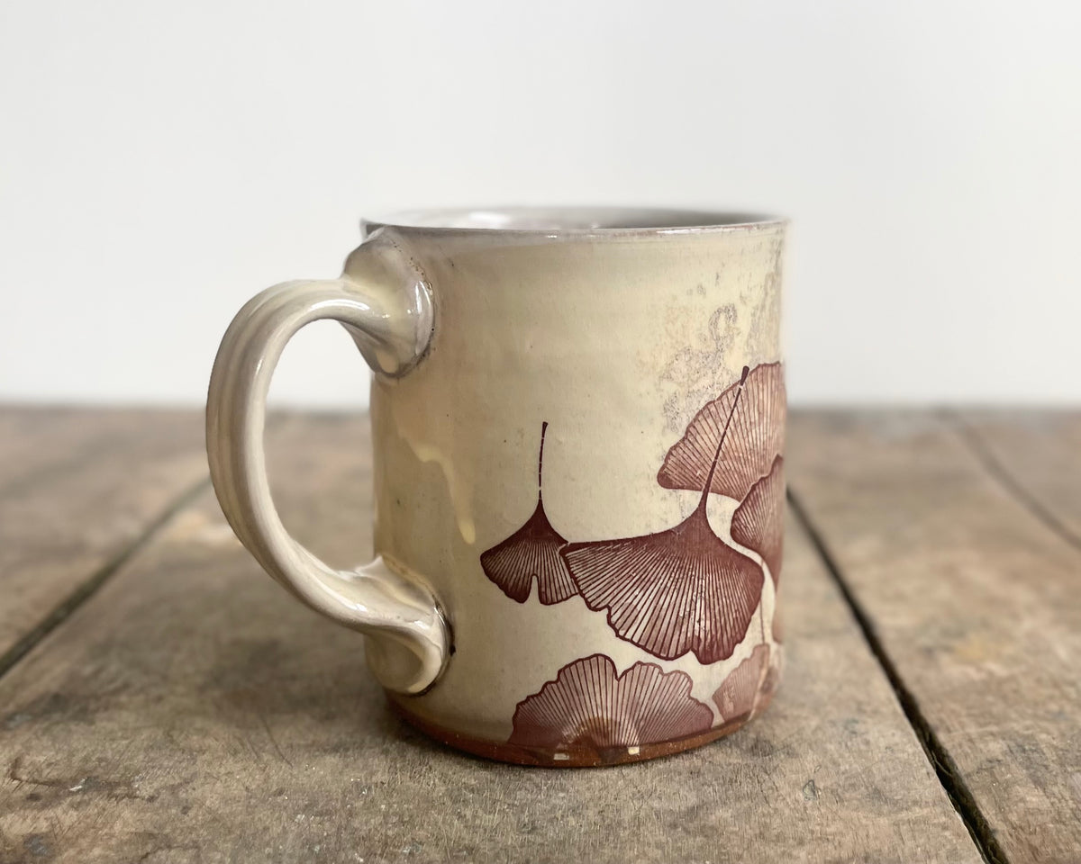 White Mug with slip, gold velociraptor and image transfer