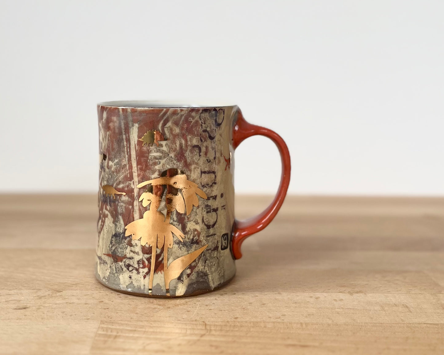Mug with slip, gold decals and image transfer
