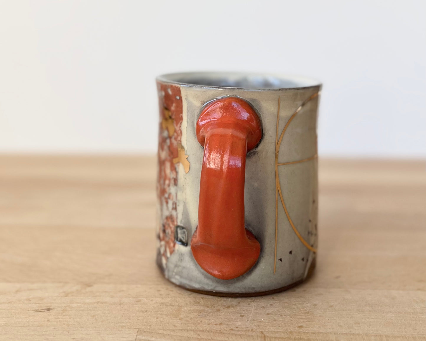 Mug with slip, gold decals and image transfer