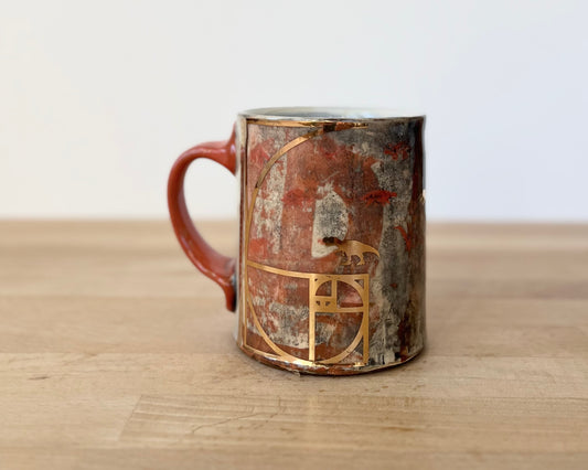 Mug with slip, gold decals and image transfer