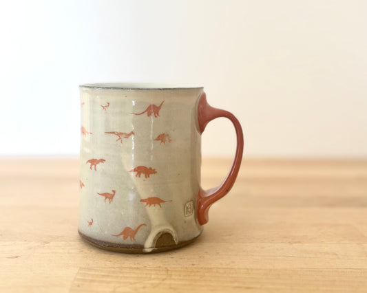Mug with small orange dinos