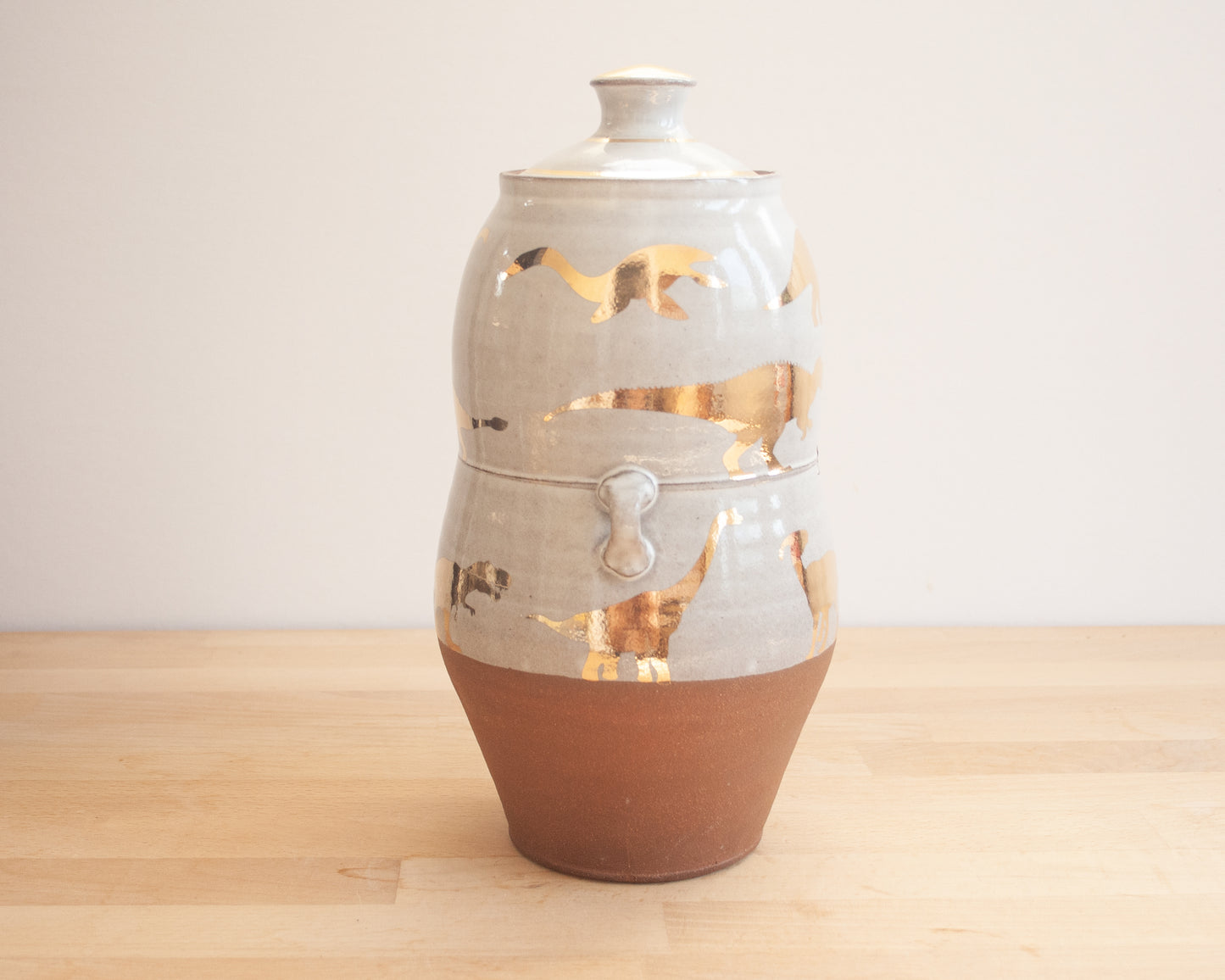 Lidded Jar with Gold Dinosaurs