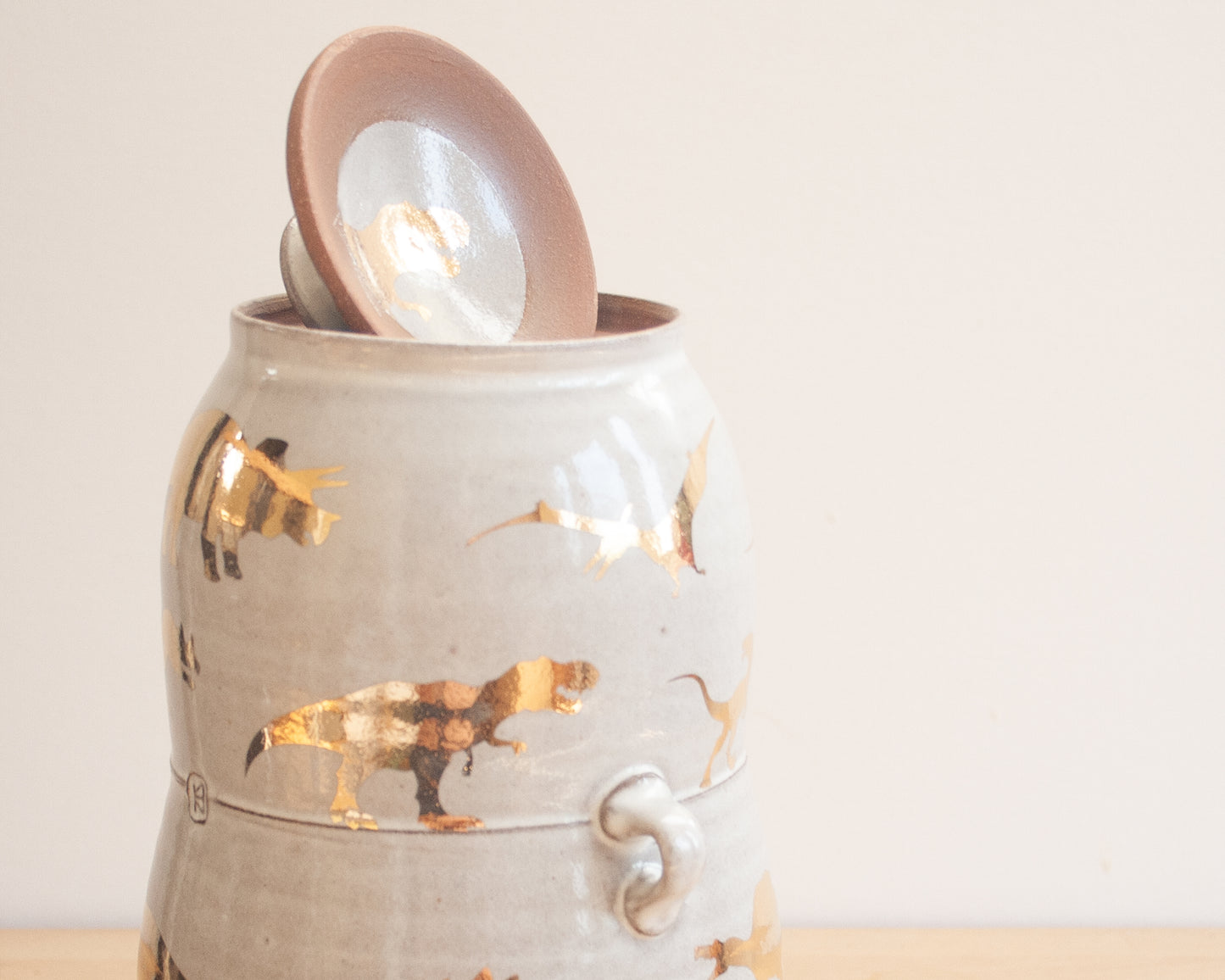 Lidded Jar with Gold Dinosaurs