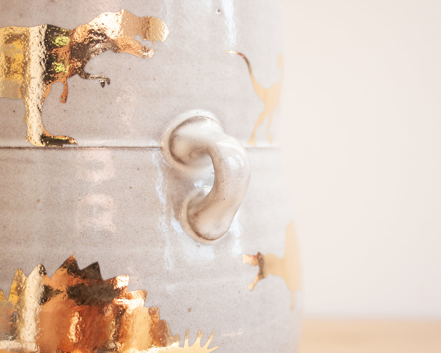 Lidded Jar with Gold Dinosaurs