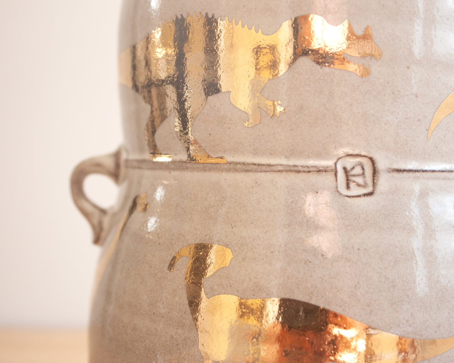 Lidded Jar with Gold Dinosaurs