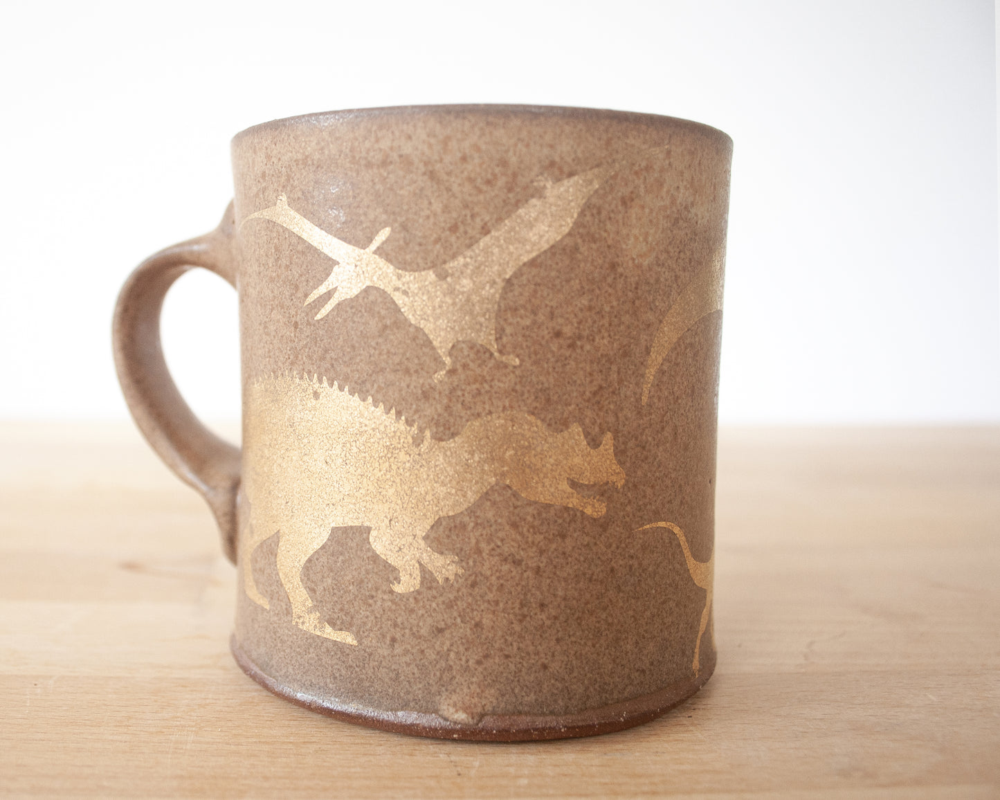 Gold Dinosaur Mug with Matte Brown Glaze