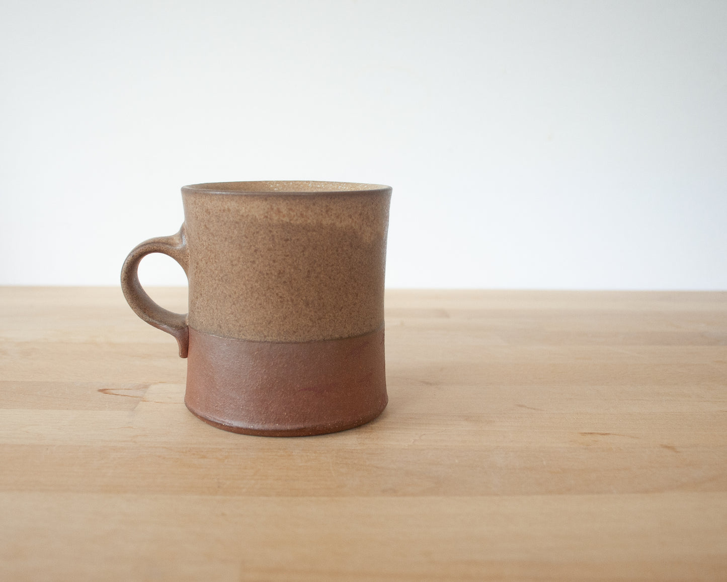 Gold Velociraptor Mug with matte brown glaze