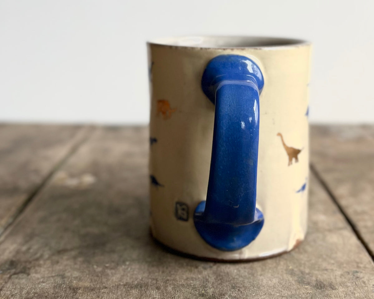 Mug with blue handle, gold decals and image transfer