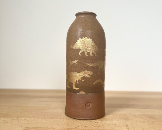 Vase with gold dinosaurs