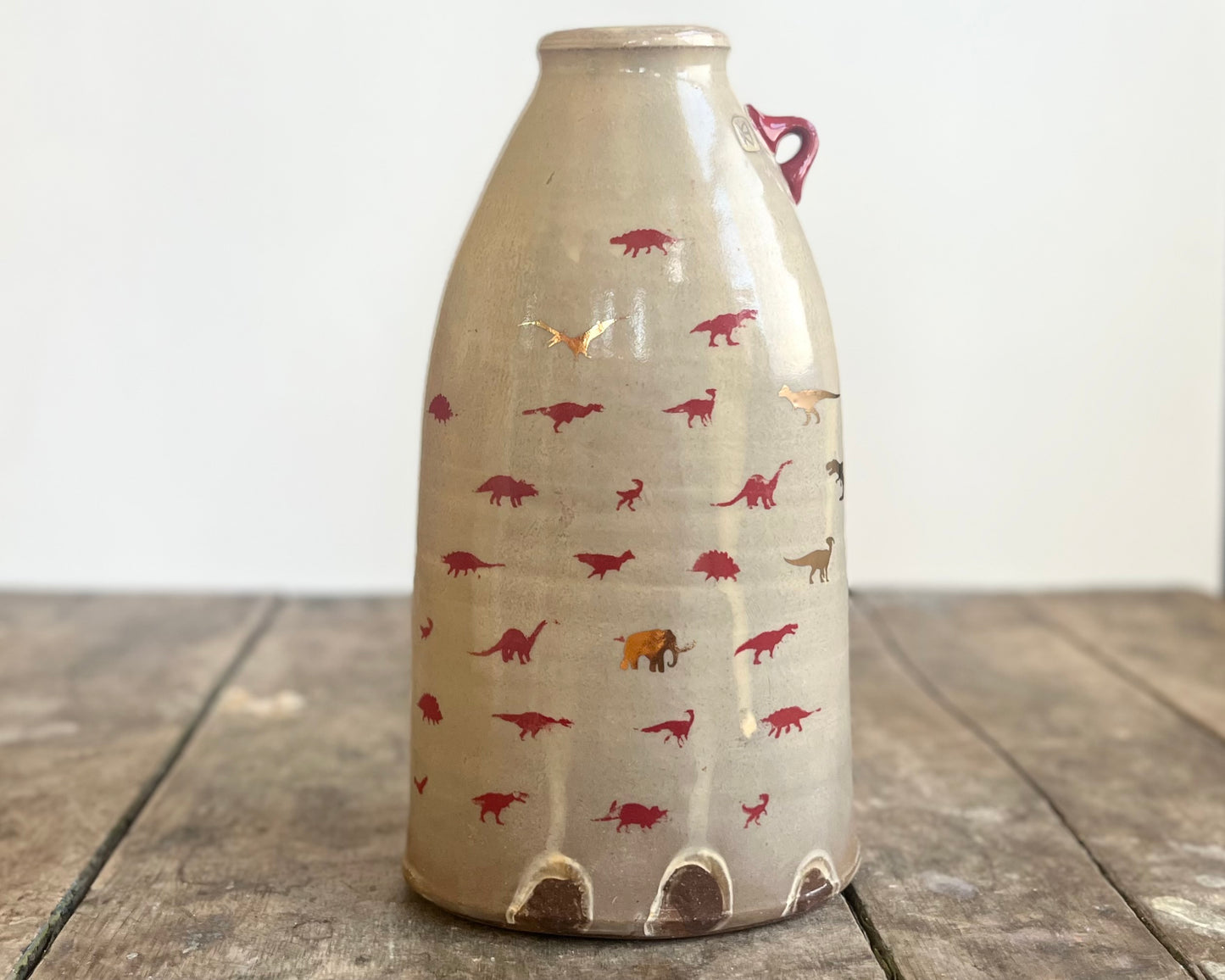 Flattened Vase with Red and Gold Dinosaurs