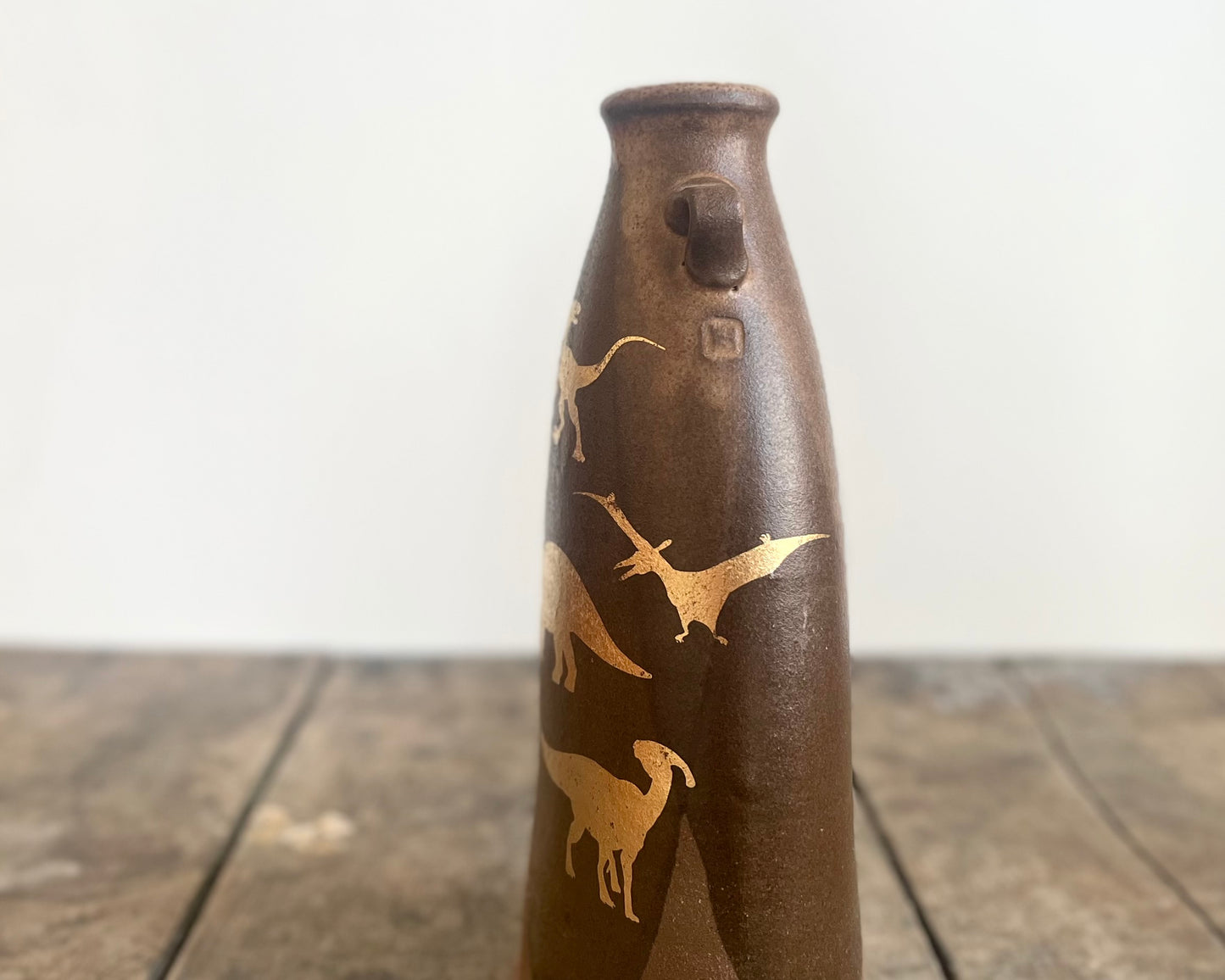 Flattened Vase with Gold Dinosaurs
