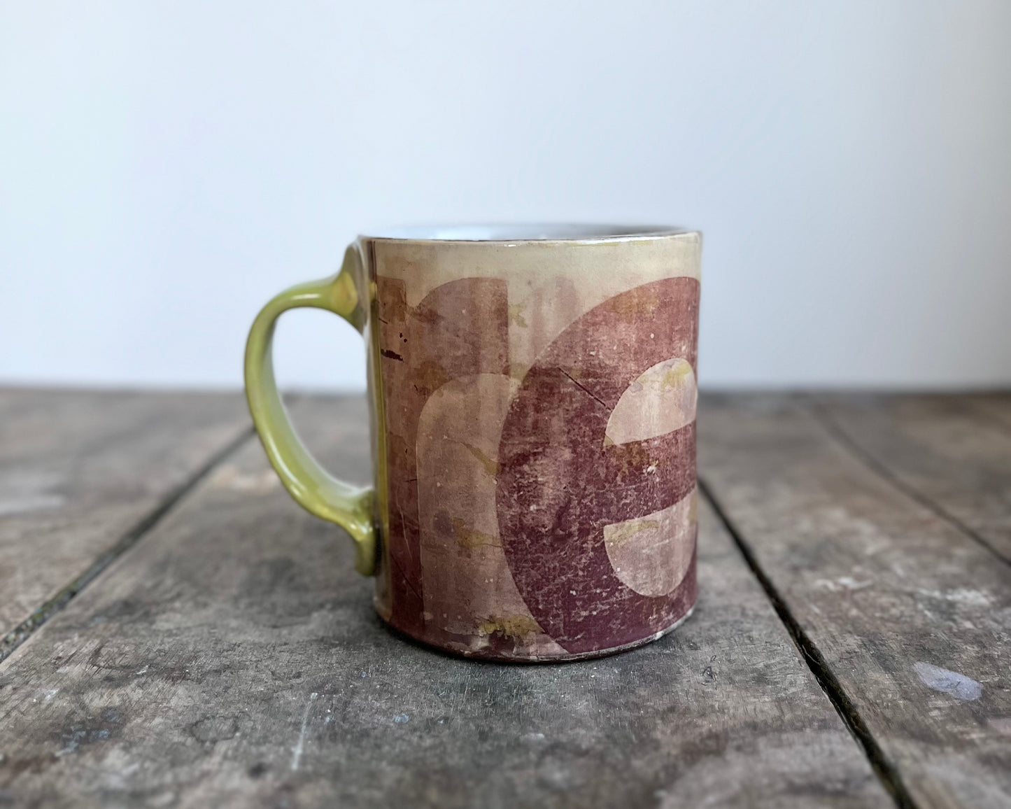 Mug with slip, gold decals and image transfer