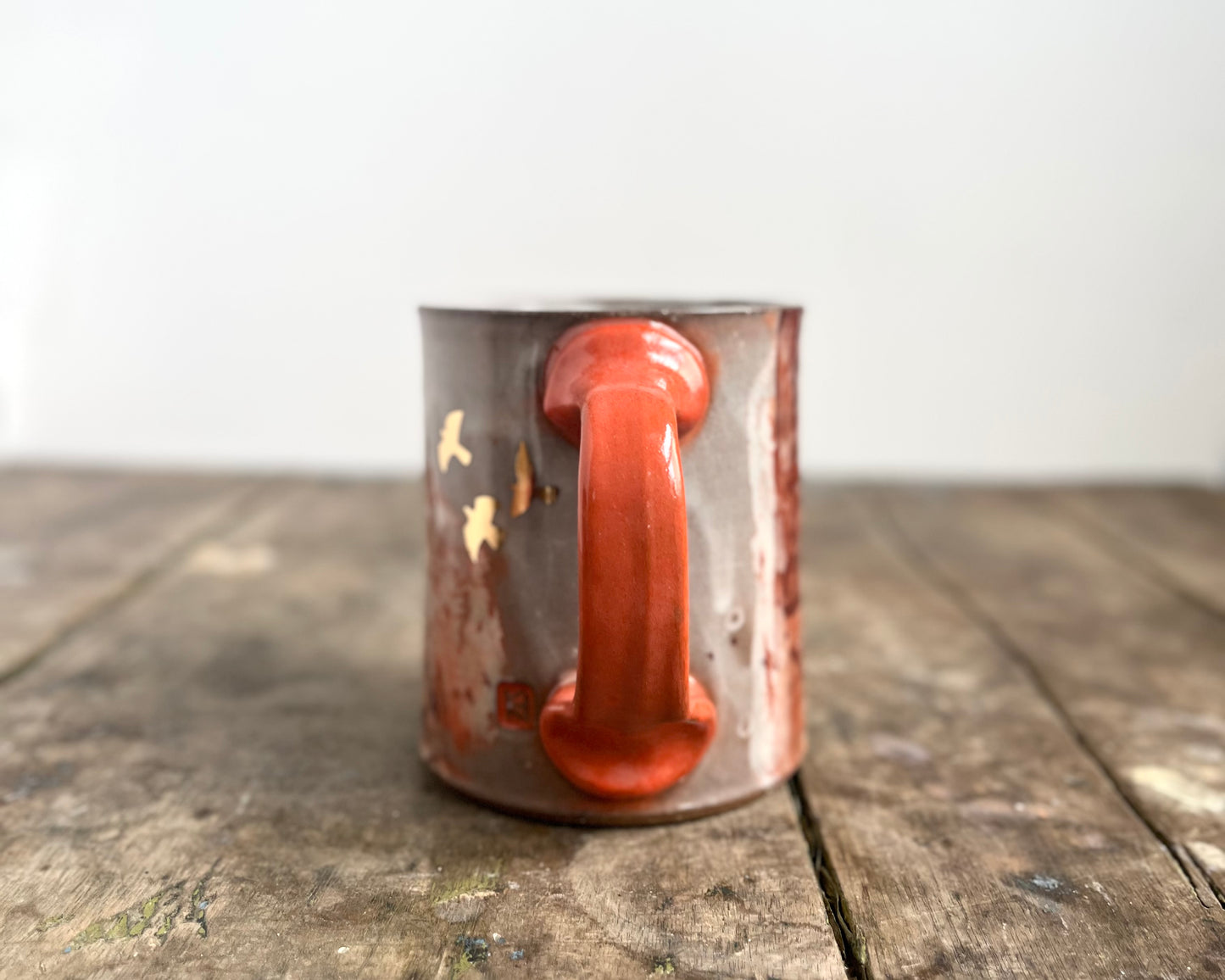 Mug with slip, gold decals and image transfer