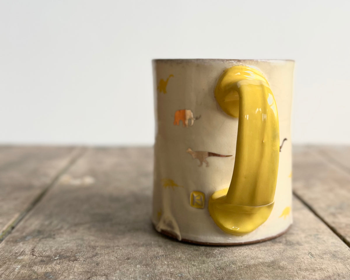 Mug with yellow handle, gold decals and image transfer