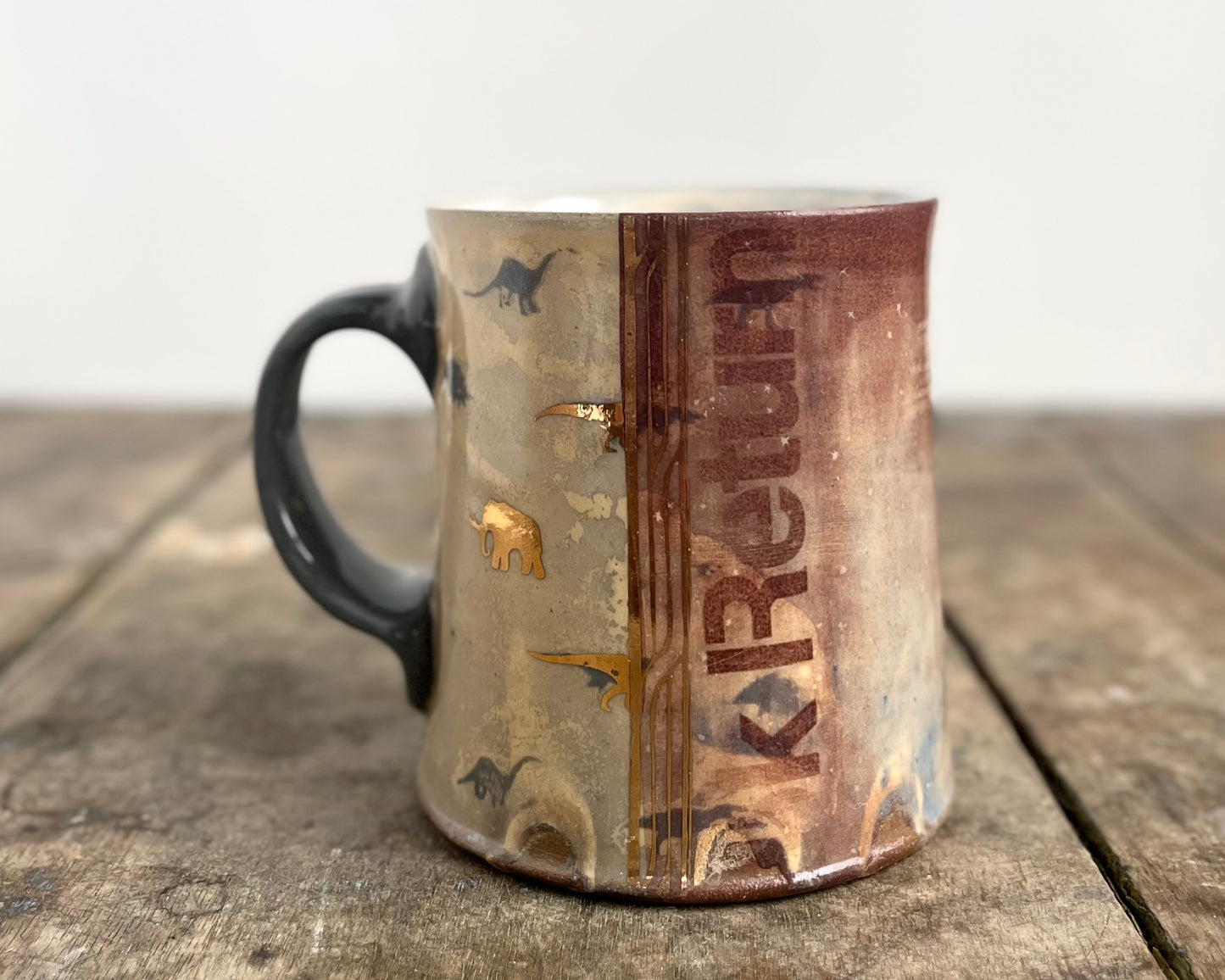 Mug with slip, gold decals and image transfer