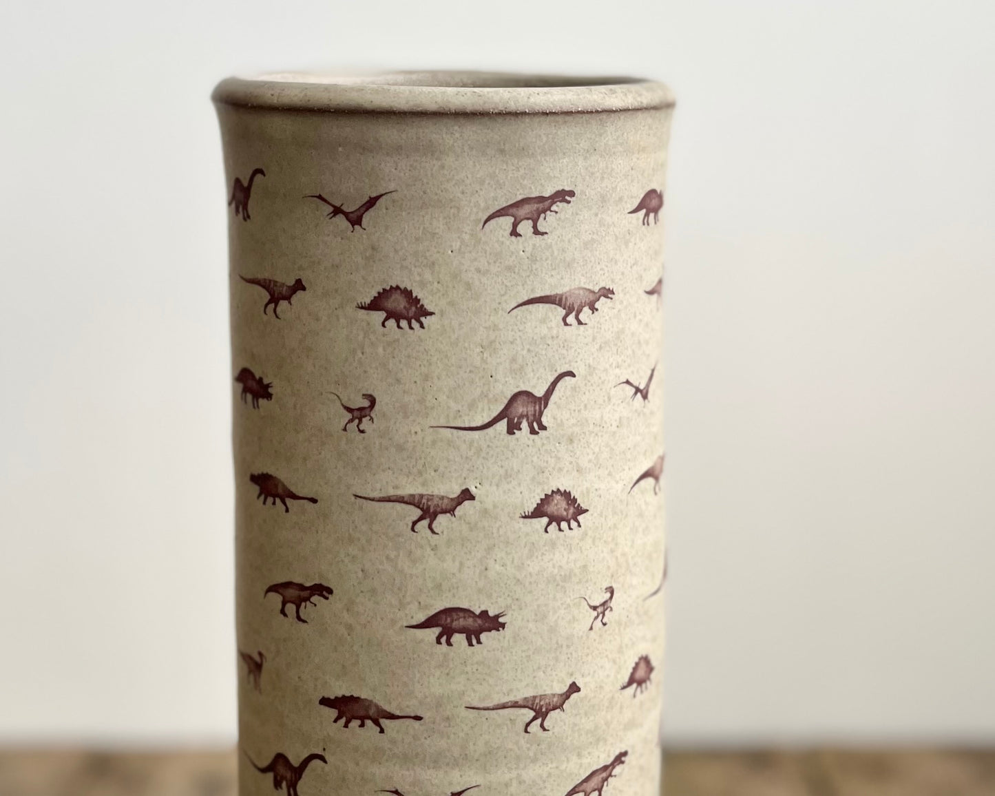 Cylindrical Vase with little dinosaurs - warm grey matte