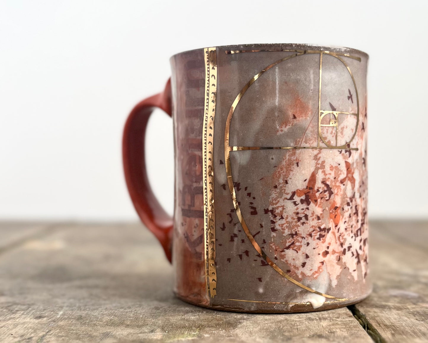 Mug with slip, gold decals and image transfer