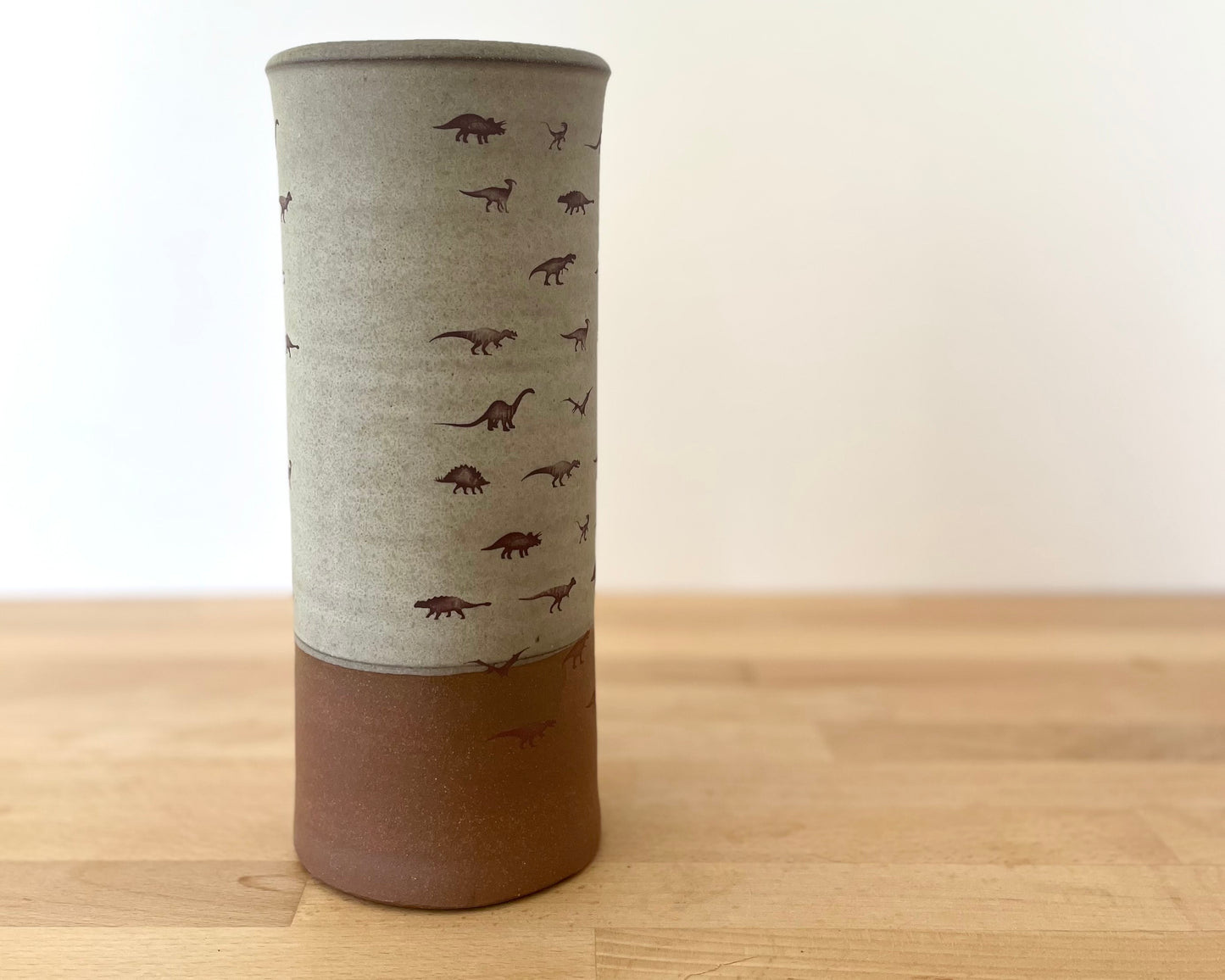 Cylindrical Vase with little dinosaurs - warm grey matte