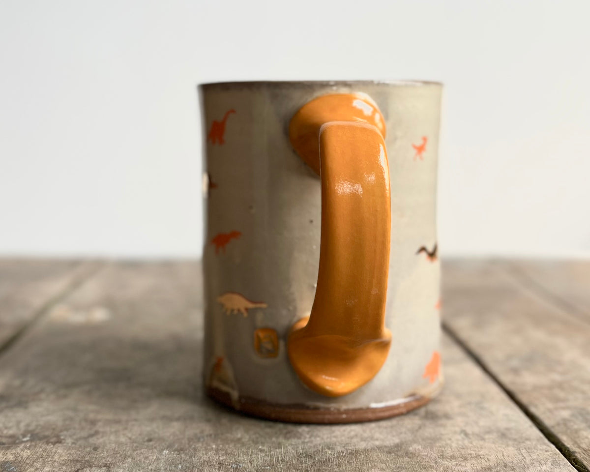 Mug with orange handle, gold decals and image transfer