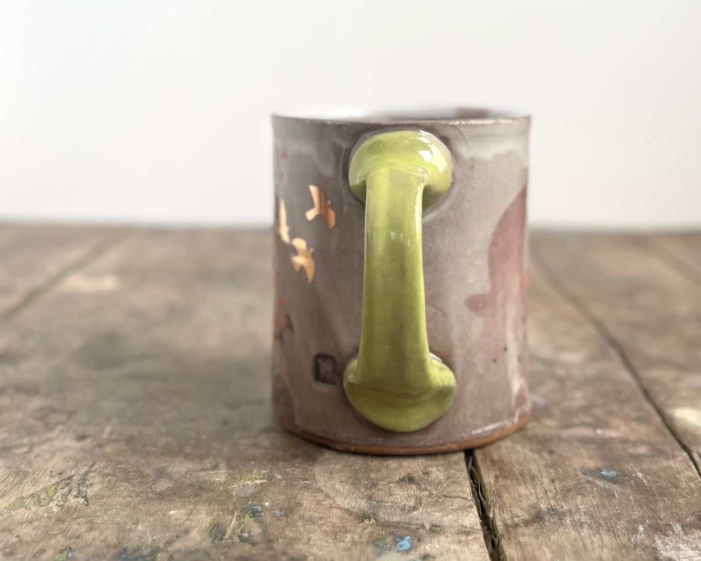 Mug with slip, gold decals and image transfer