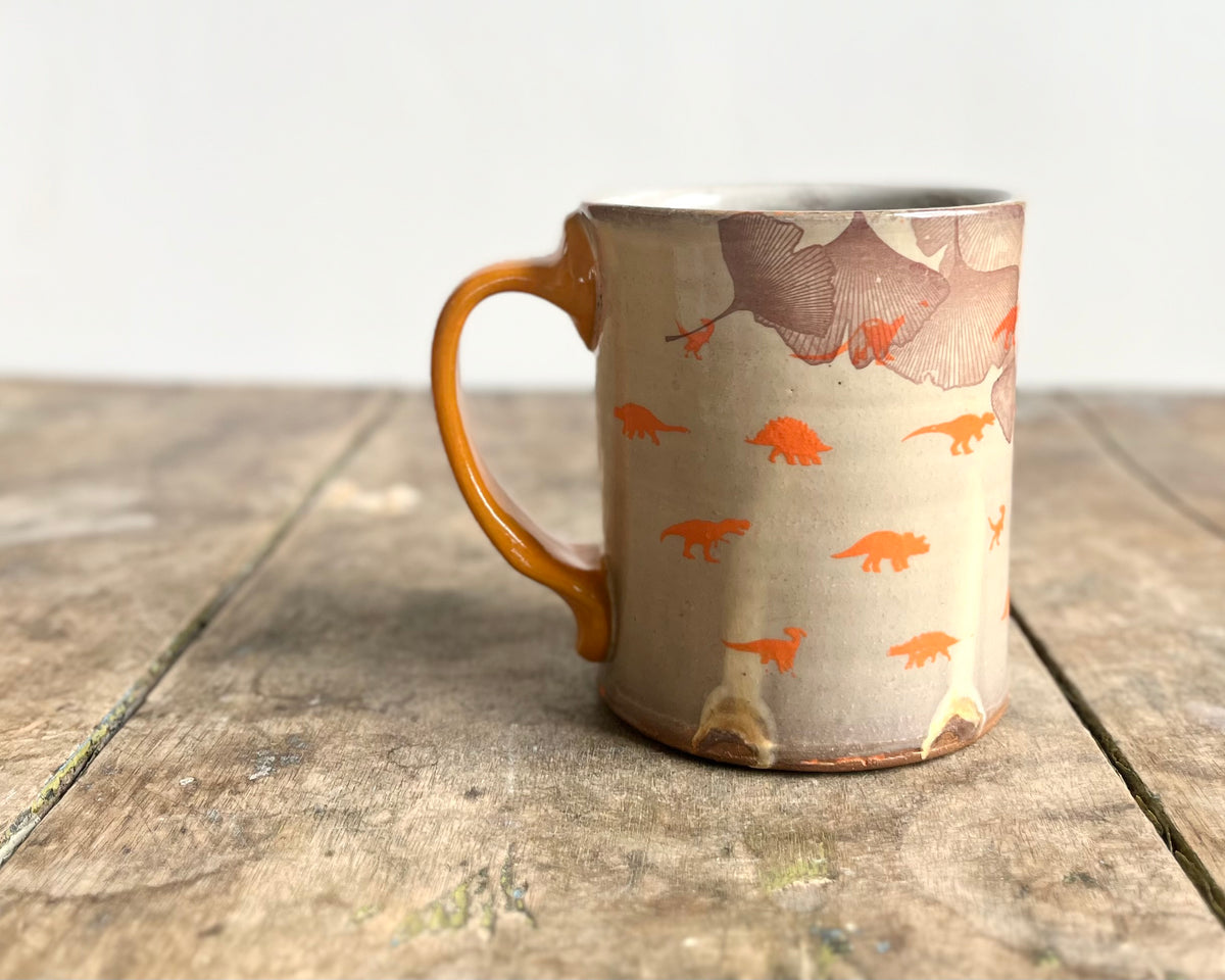 Mug with orange handle, gold decals and image transfer