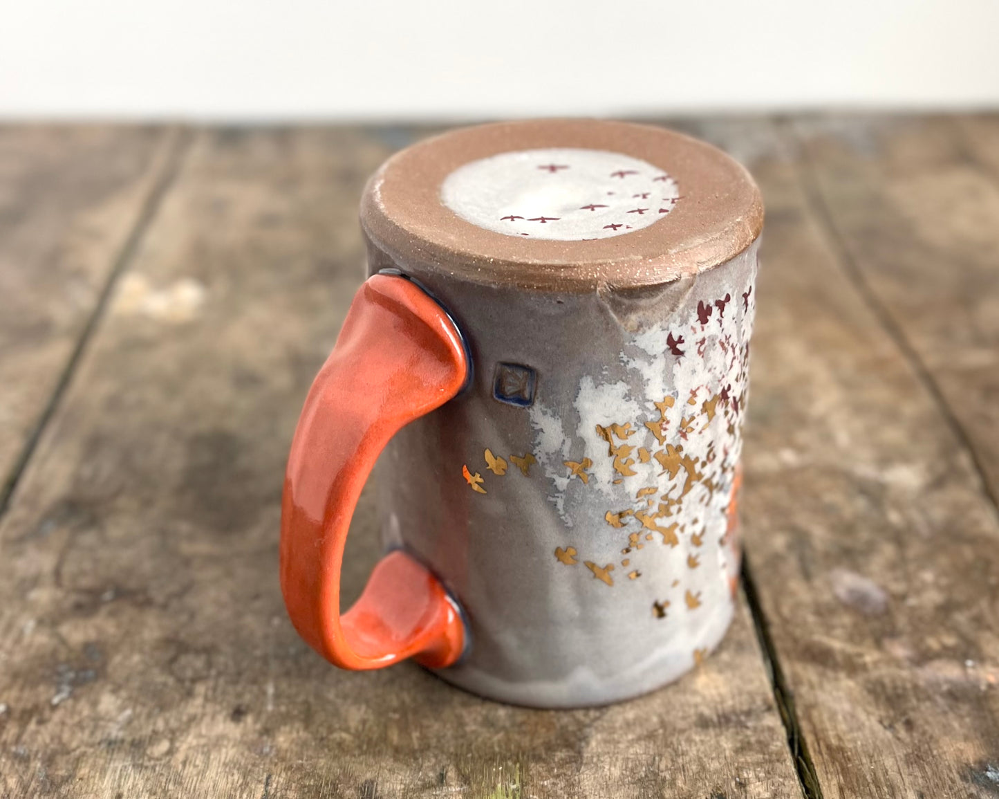 Mug with slip, gold decals and image transfer