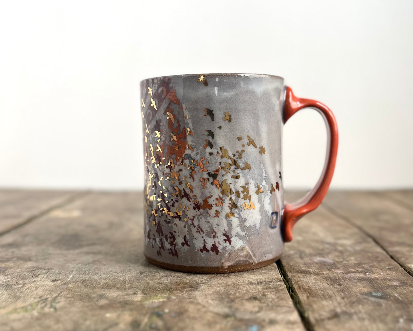 Mug with slip, gold decals and image transfer