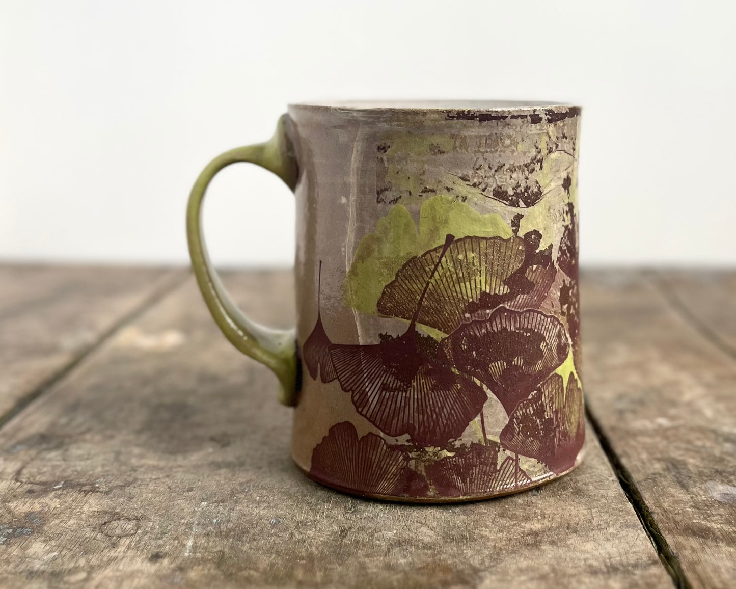 Mug with slip, gold decals and image transfer