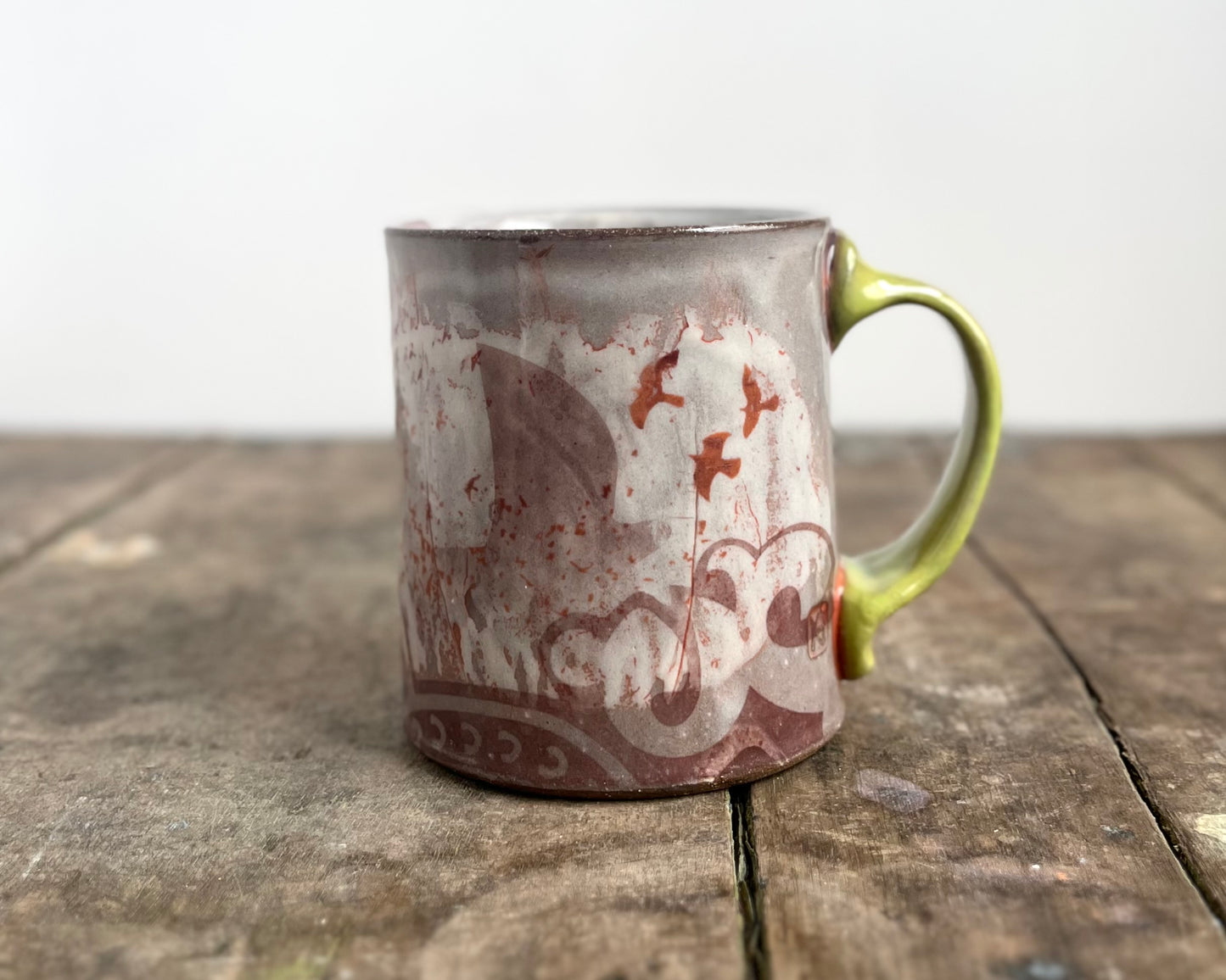 Mug with slip, gold decals and image transfer