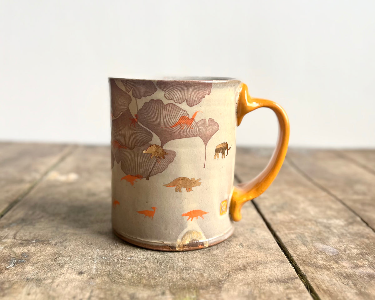 Mug with orange handle, gold decals and image transfer