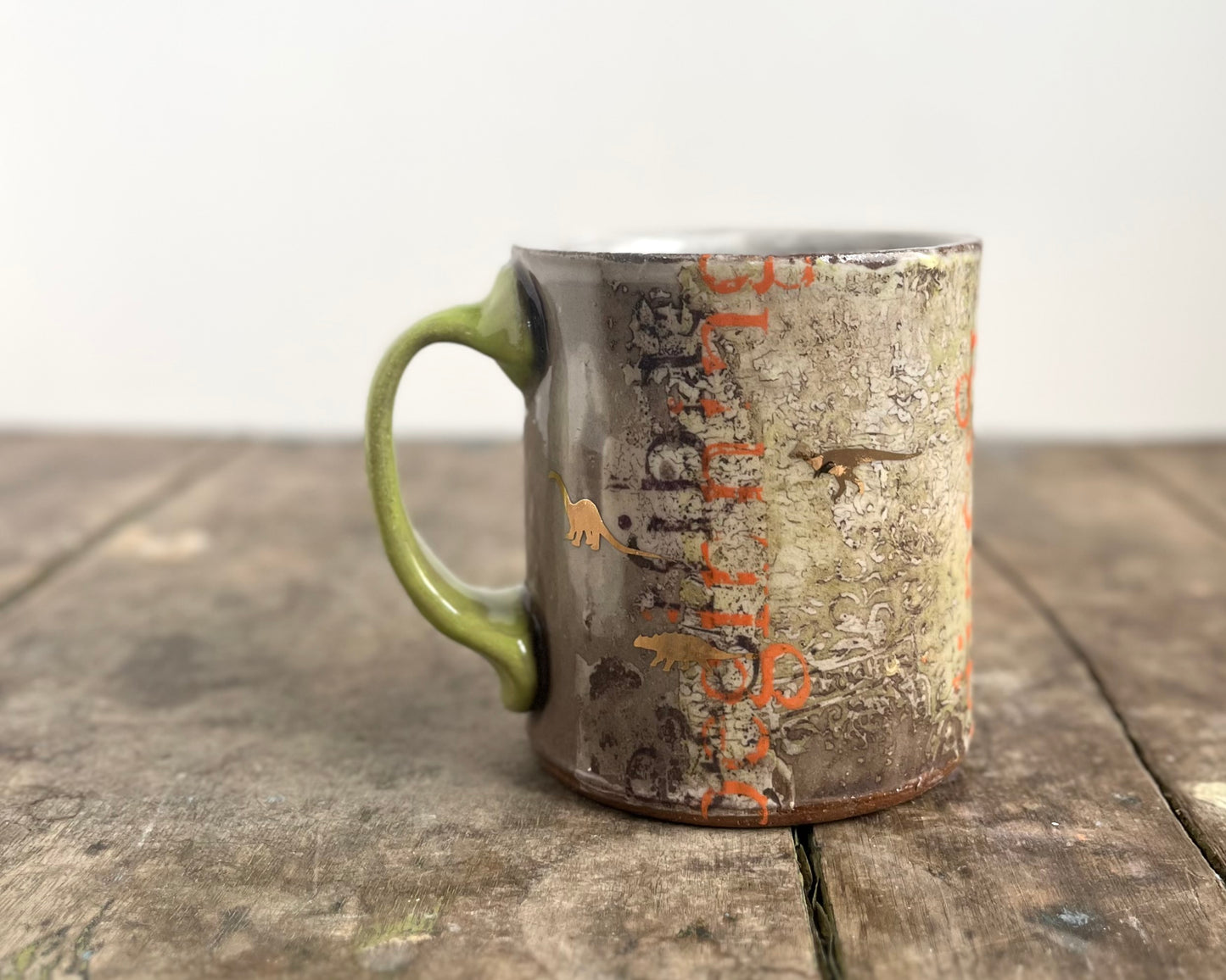 Mug with slip, gold decals and image transfer