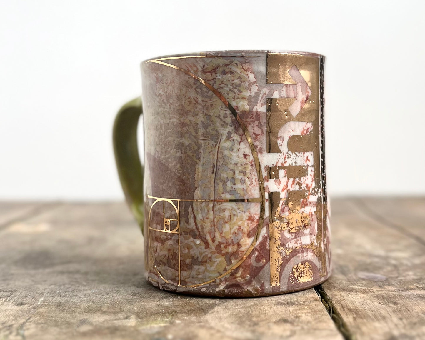 Mug with slip, gold decals and image transfer