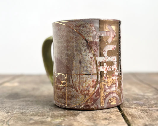 Mug with slip, gold decals and image transfer